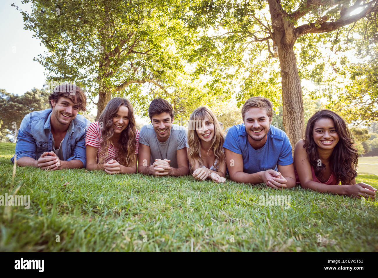 happy friends in a park Stock Photo - Alamy