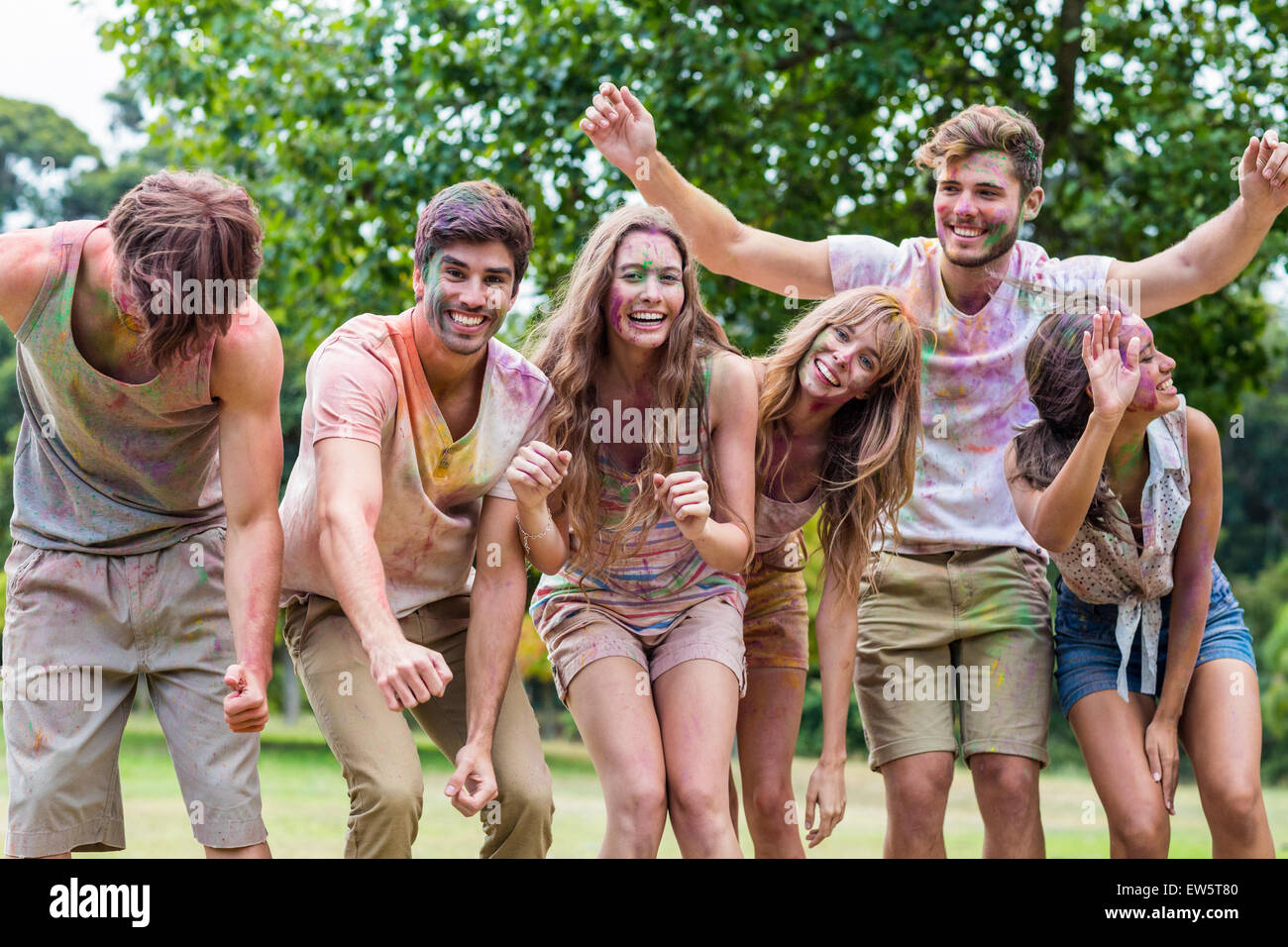 Happy friends covered in powder paint Stock Photo