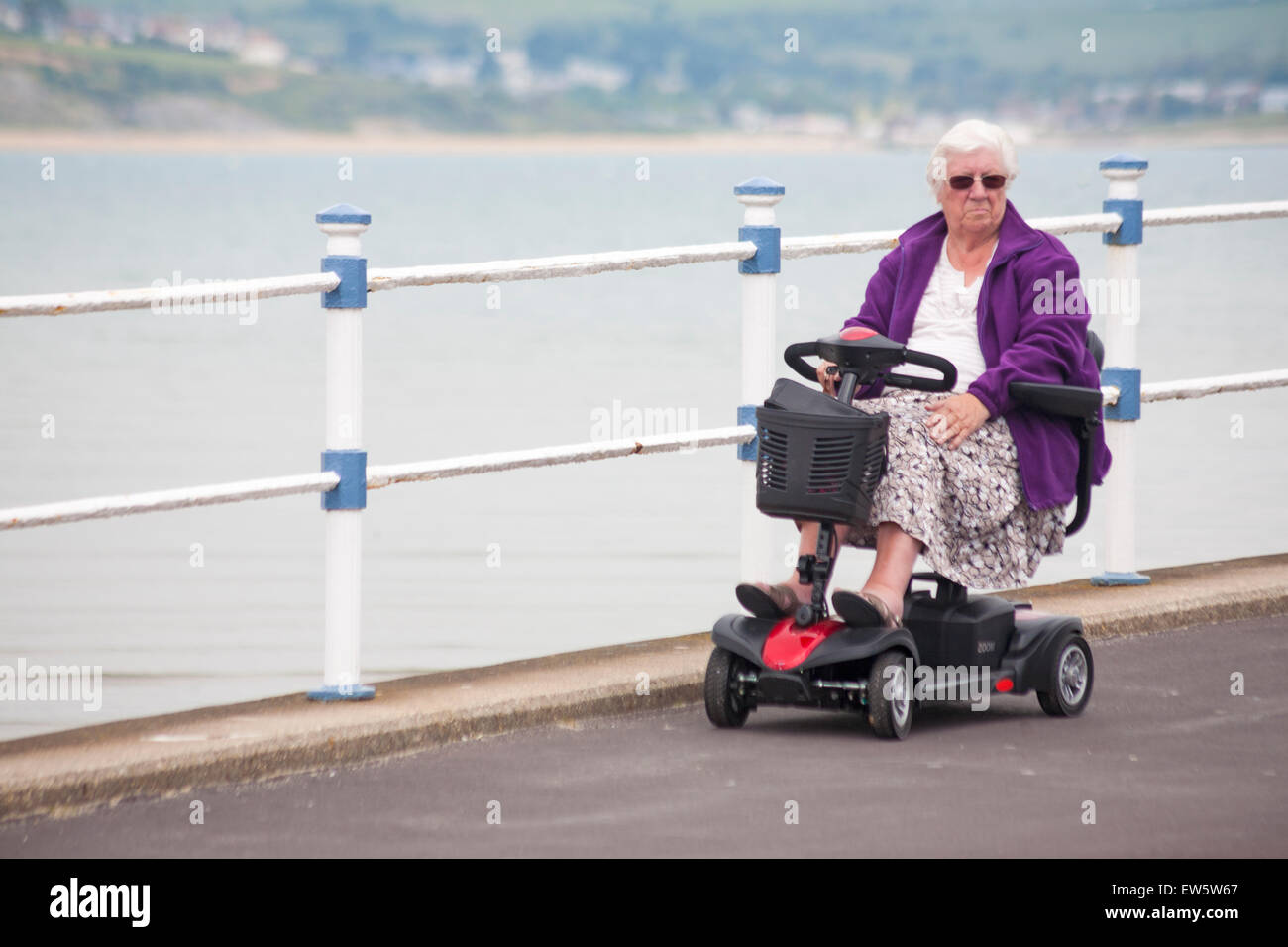 Old lady riding mobility scooter hires stock photography and images Alamy