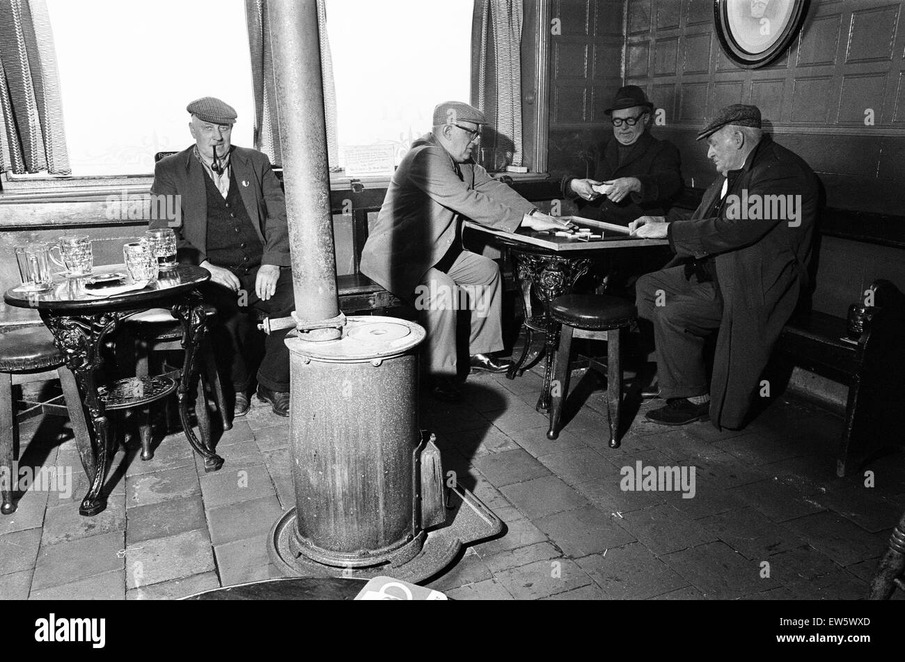 Group of men play dominoes at the Druids Head Inn in Coseley, a suburban area in the north of the Dudley,  The Black Country, an area of the West Midlands in England, north and west of Birmingham. 25th May 1968. Stock Photo