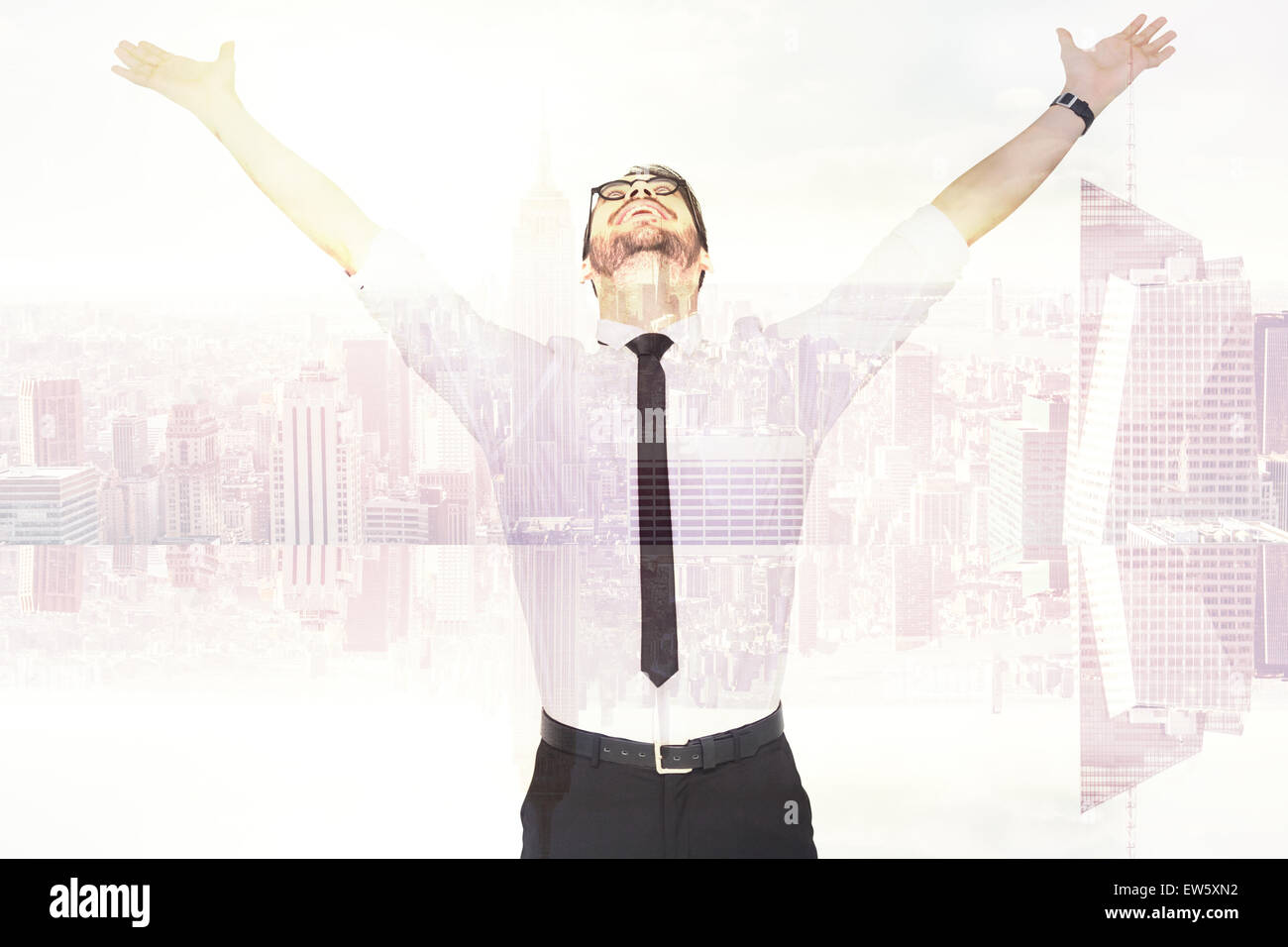 Composite image of cheering businessman with his arms raised up Stock Photo