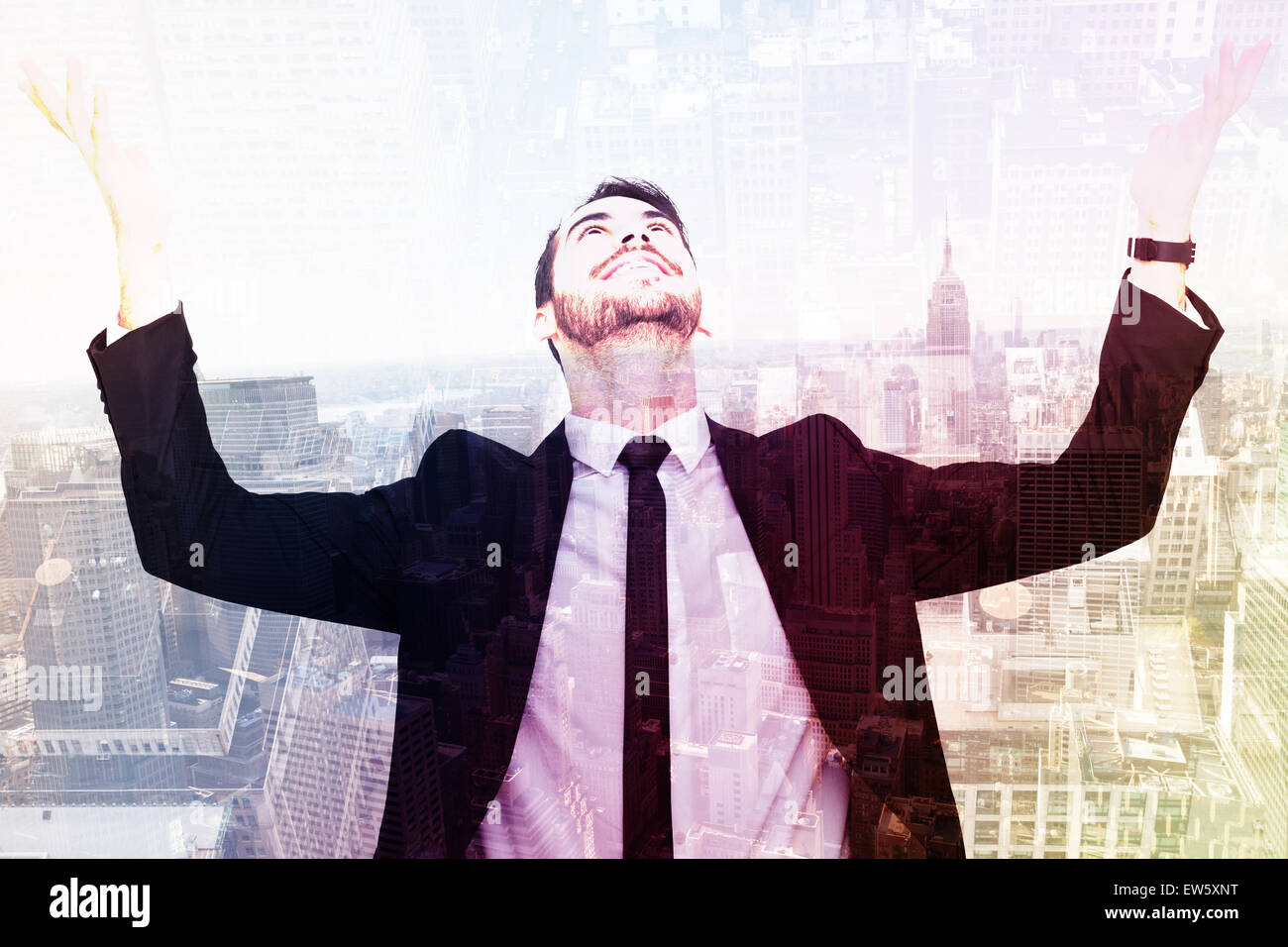Composite image of businessman cheering with hands raised Stock Photo