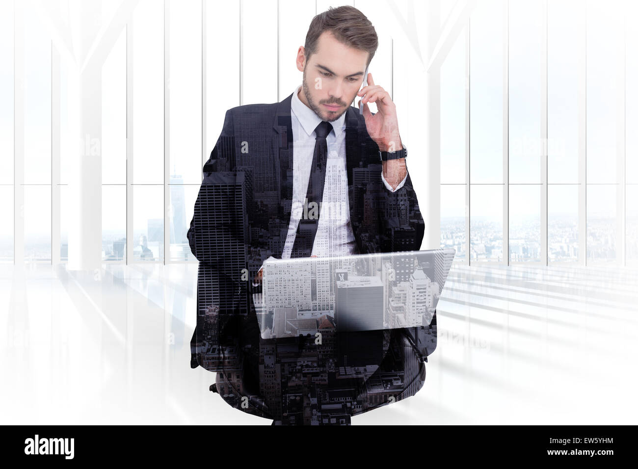 Composite image of businessman using laptop while phoning Stock Photo