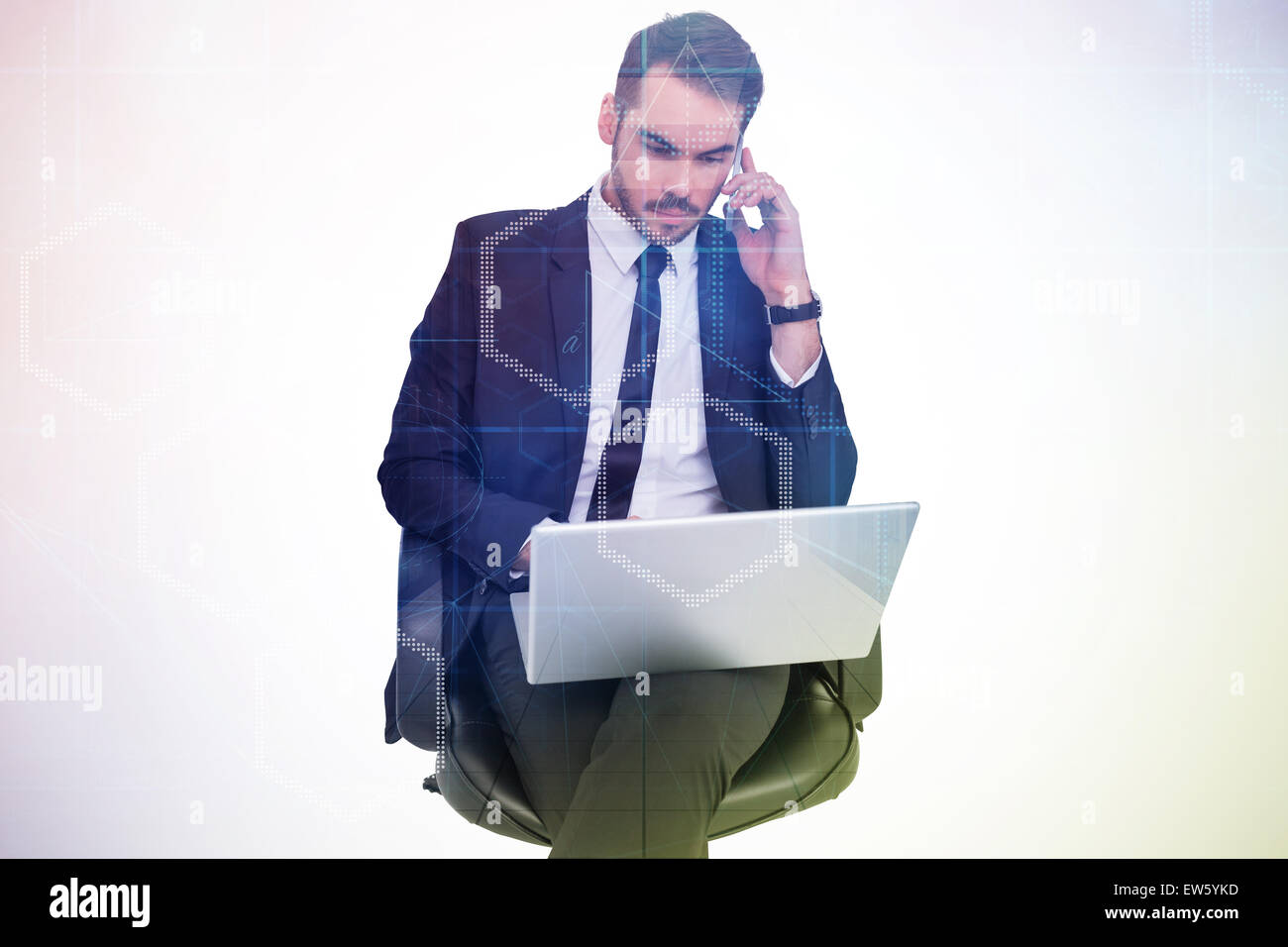 Composite image of businessman using laptop while phoning Stock Photo