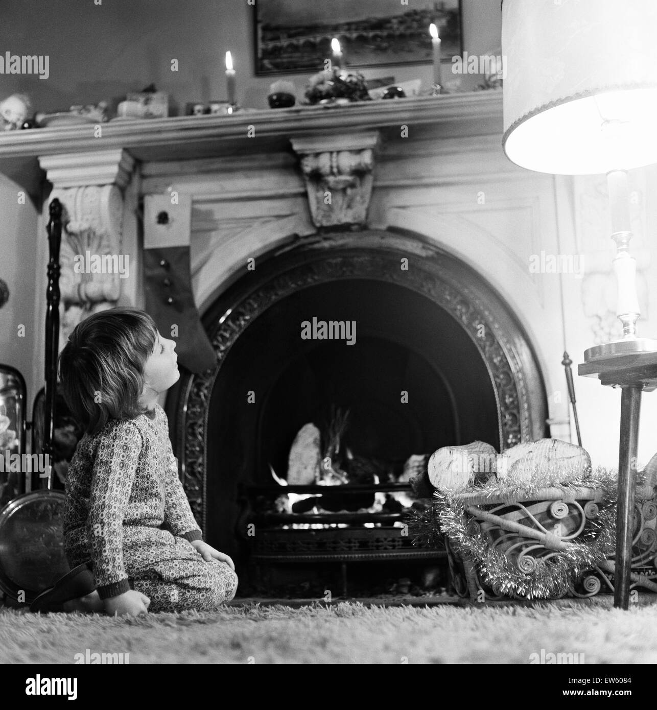 Christmas Eve, Child waits patiently for Father Christmas, Newcastle, Tyne and Wear. Posed picture taken 18th December 1974. Stock Photo