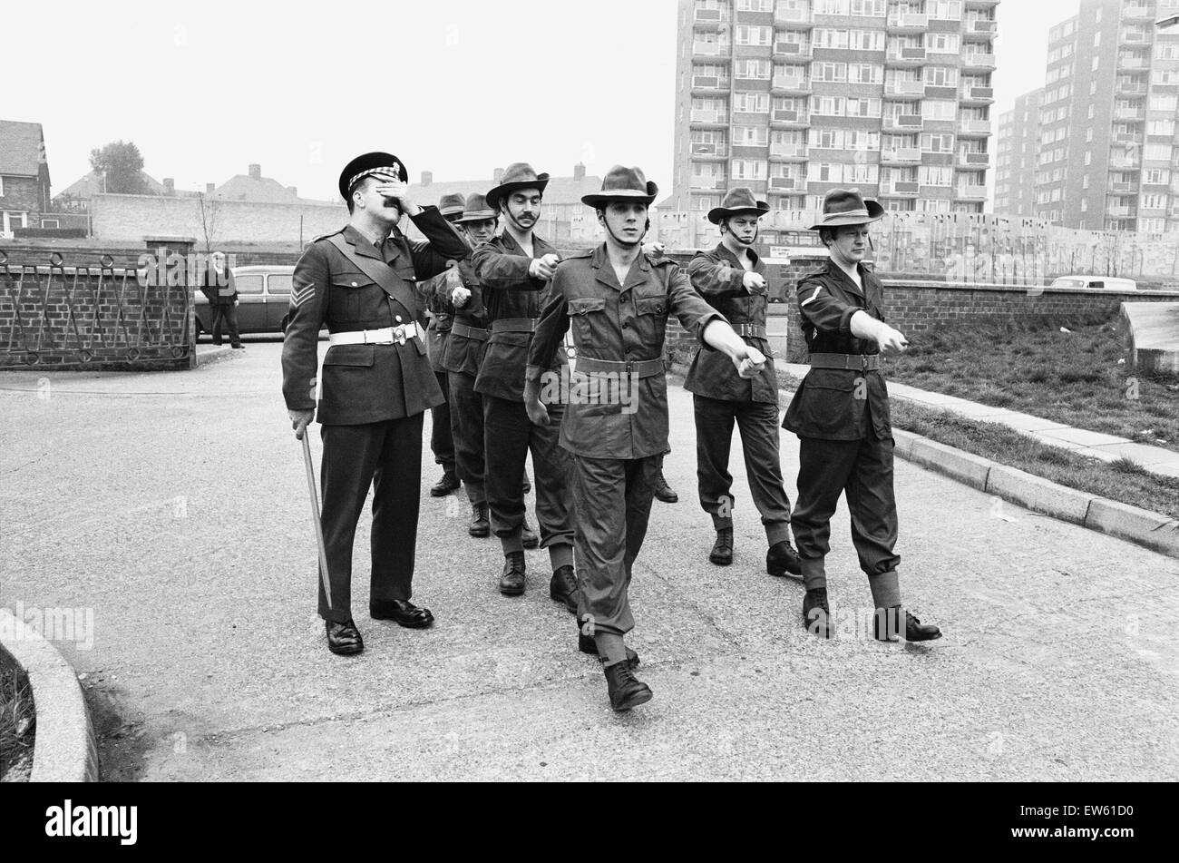 Sergeant Bill Davies of the Scots Guard, drills Brian Miller, William Ellis, Graham Corry, Stephen Berkoff, Warren Clarke, Tony Colegate and William Kendrick, members of the Liverpool Playhouse cast for their roles in 'the Long and the Short and the Tall Stock Photo