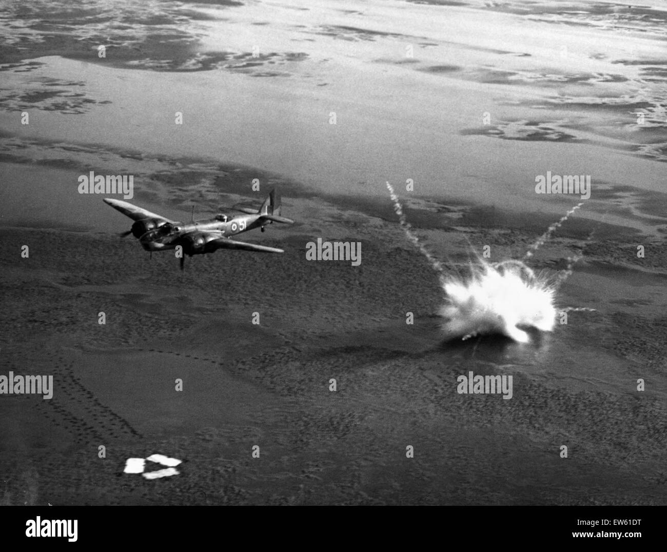 At a famous Air Armament School in Eastern England, bomb aimers who have proved themselves in operations are trained as 'captains' of squadron bomb-aimers. Picture shows: bombing practice on the ranges from 'zero' height during the Second World War. Janua Stock Photo