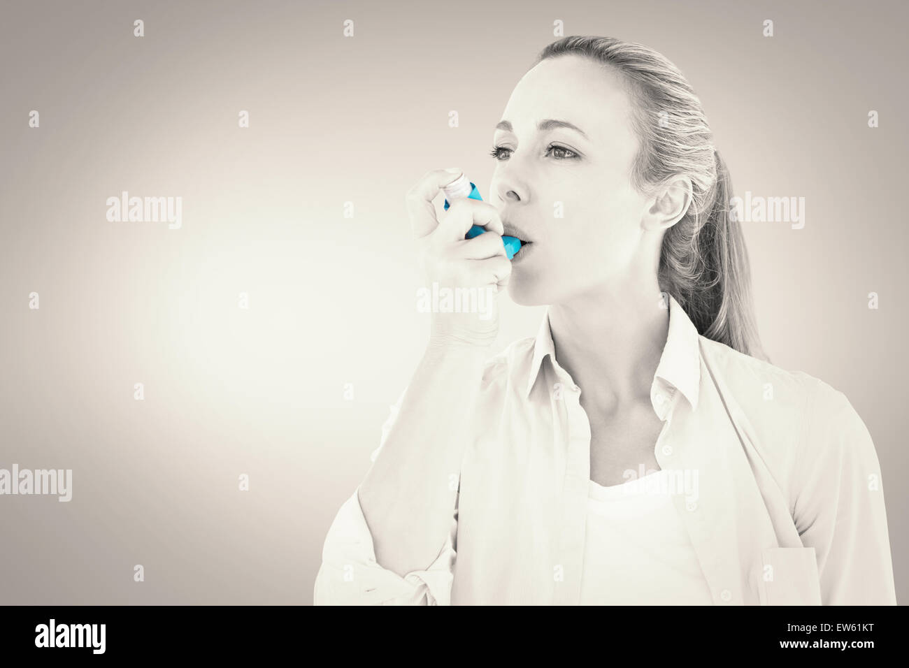 Pretty Inhaler Composite image of pretty blonde using an asthma inhaler Stock Photo ...