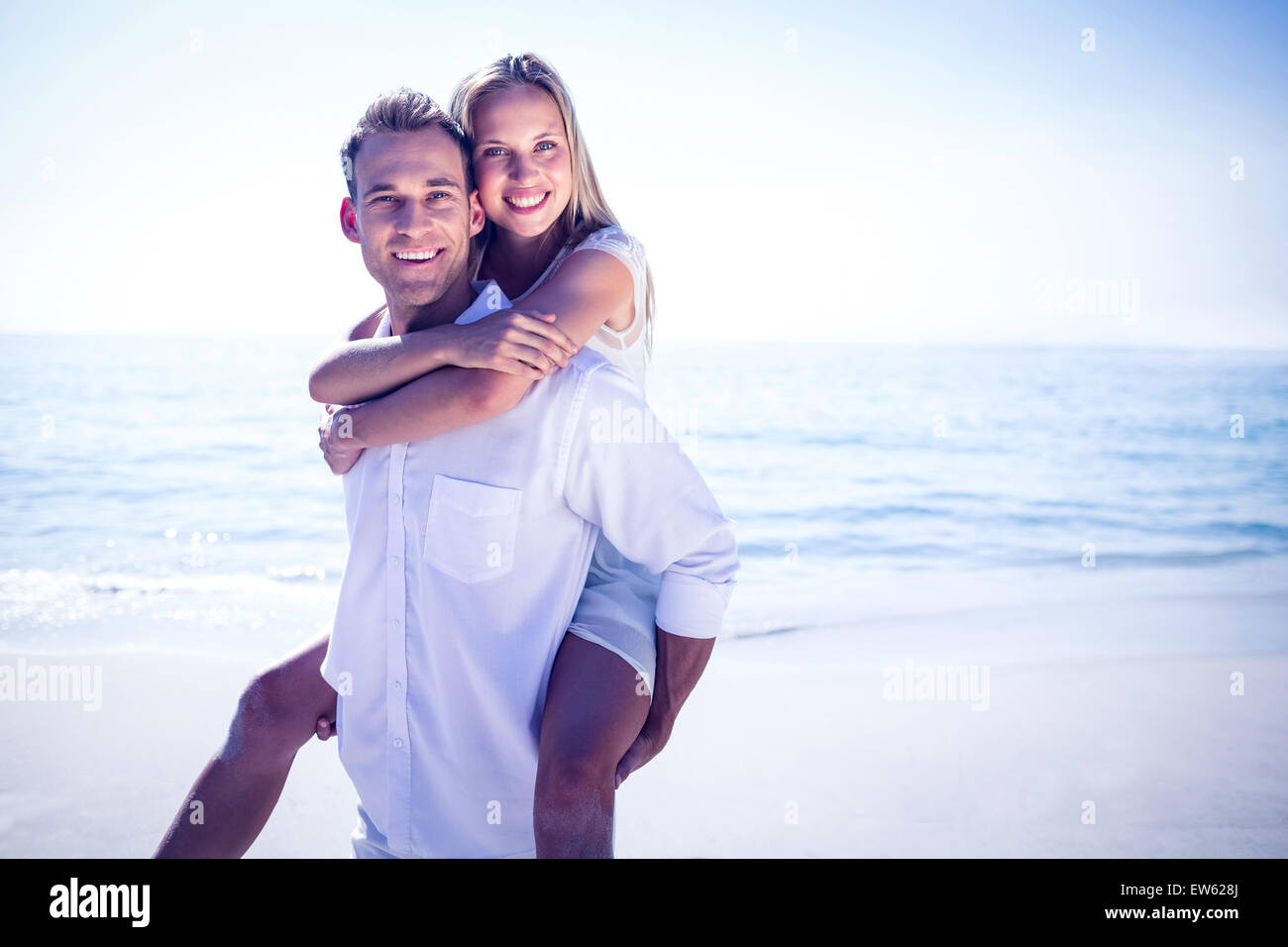 Happy couple having fun on the beach Stock Photo - Alamy