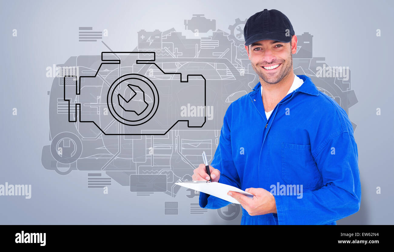 Composite image of handyman in blue overall writing on clipboard Stock Photo