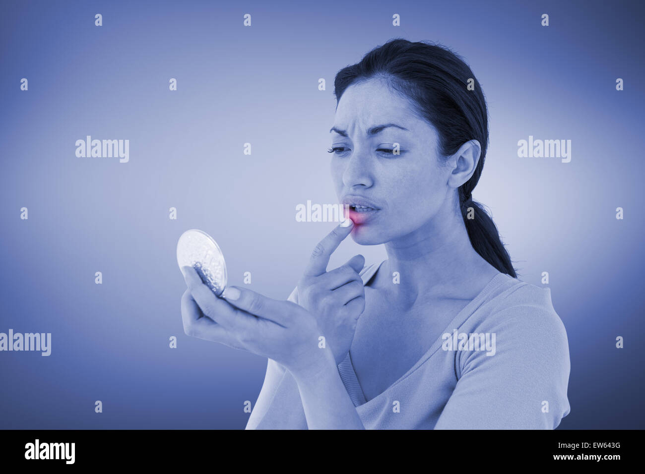 Composite image of worried woman looking at her lips Stock Photo