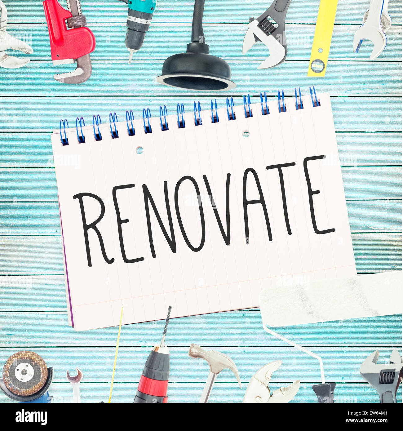 Renovate  against tools and notepad on wooden background Stock Photo
