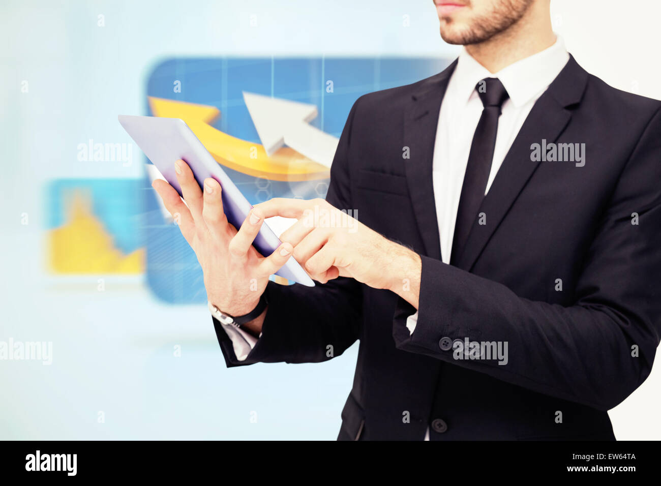 Composite image of mid section of a businessman using digital tablet pc Stock Photo
