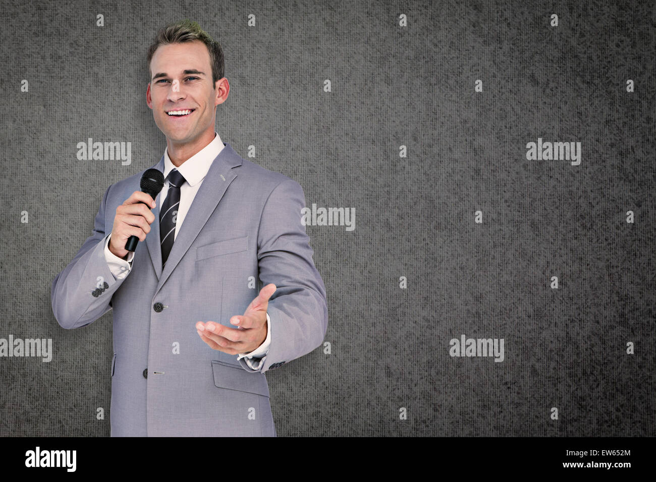 Composite image of businessman giving speech Stock Photo