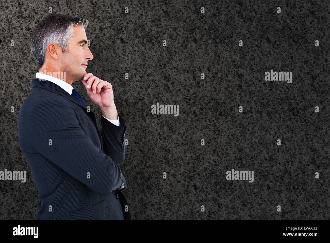 Composite image of elegant businessman in suit posing Stock Photo