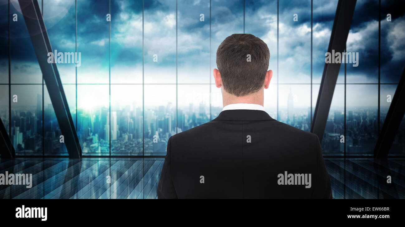 Composite image of  businessman looking in front of him in suit Stock Photo