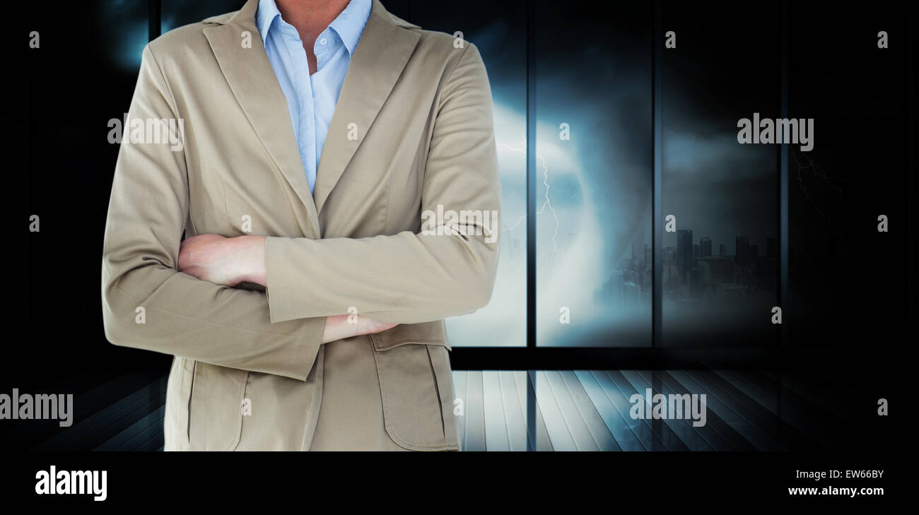 Composite image of businesswoman in suit smiling at camera Stock Photo