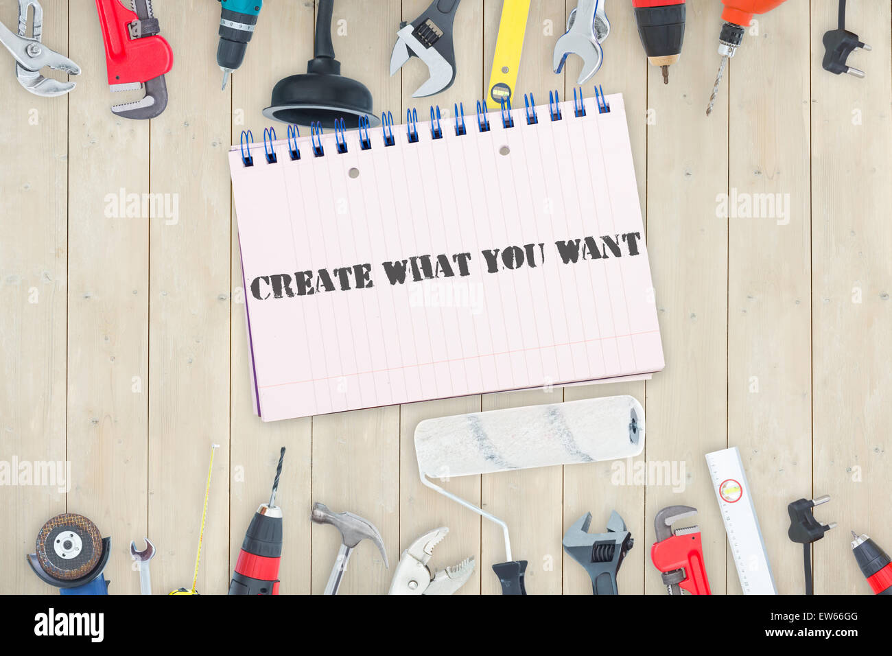 Create what you want against tools and notepad on wooden background ... image.