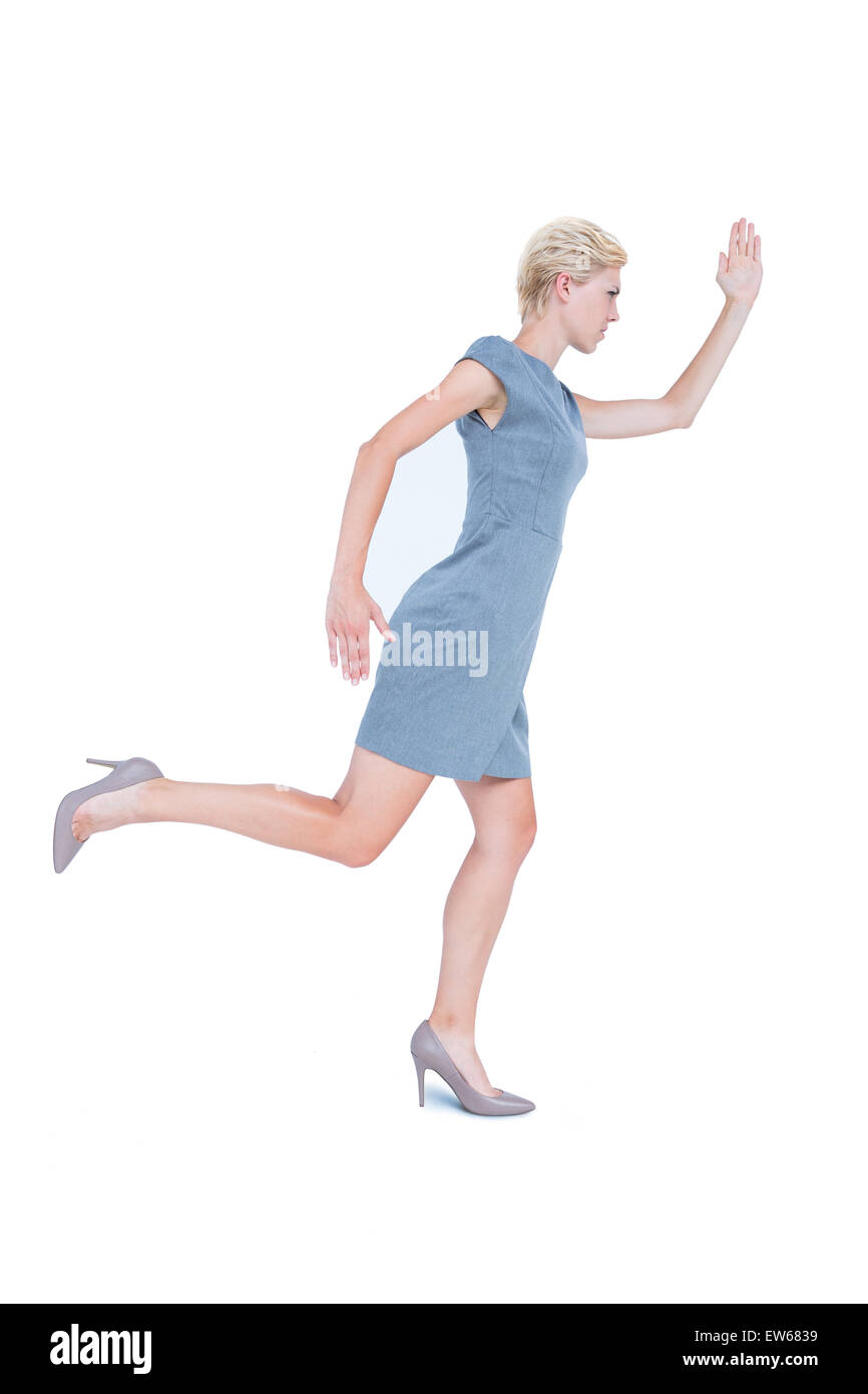 Businesswoman running in a hurry Stock Photo - Alamy
