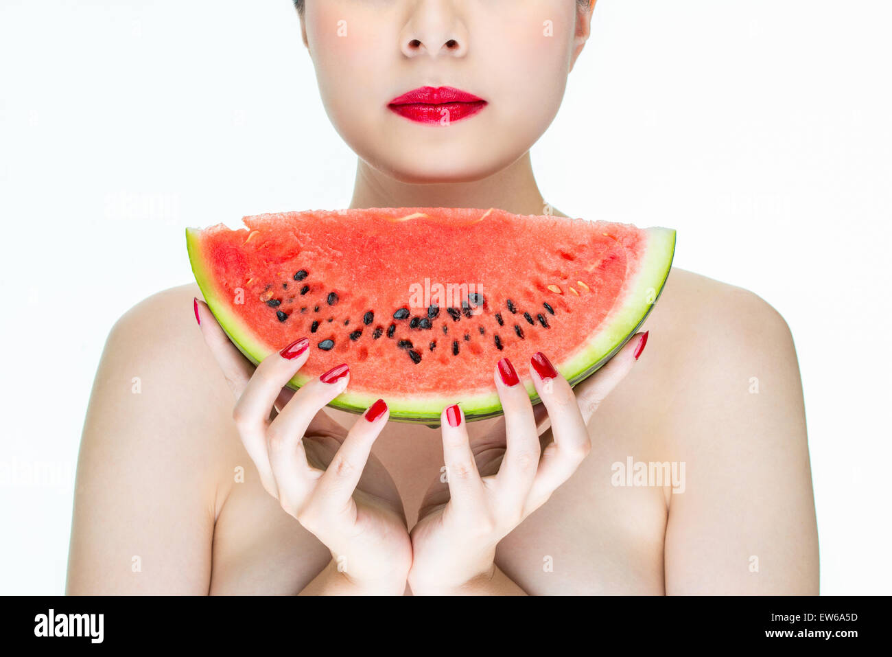 Beauty Fashion woman with watermelon, red lips, Nail Polish, holding Stock Photo