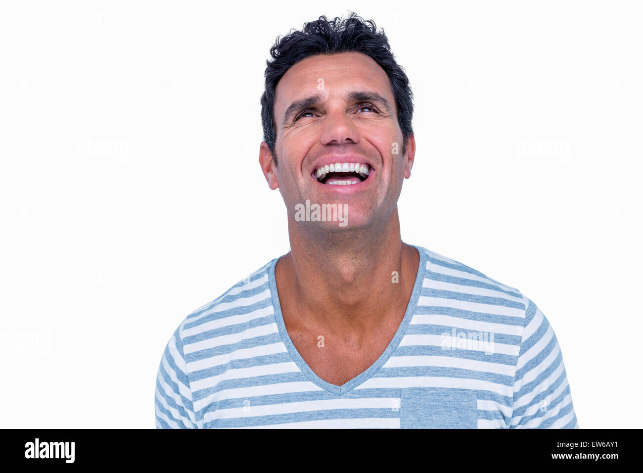 Handsome man laughing and looking away Stock Photo - Alamy