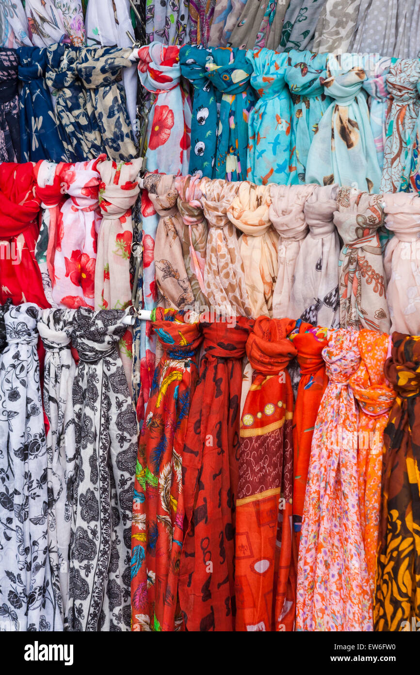 Colourful scarves for sale on market stall in Dorchester, Dorset, UK in June Stock Photo Alamy