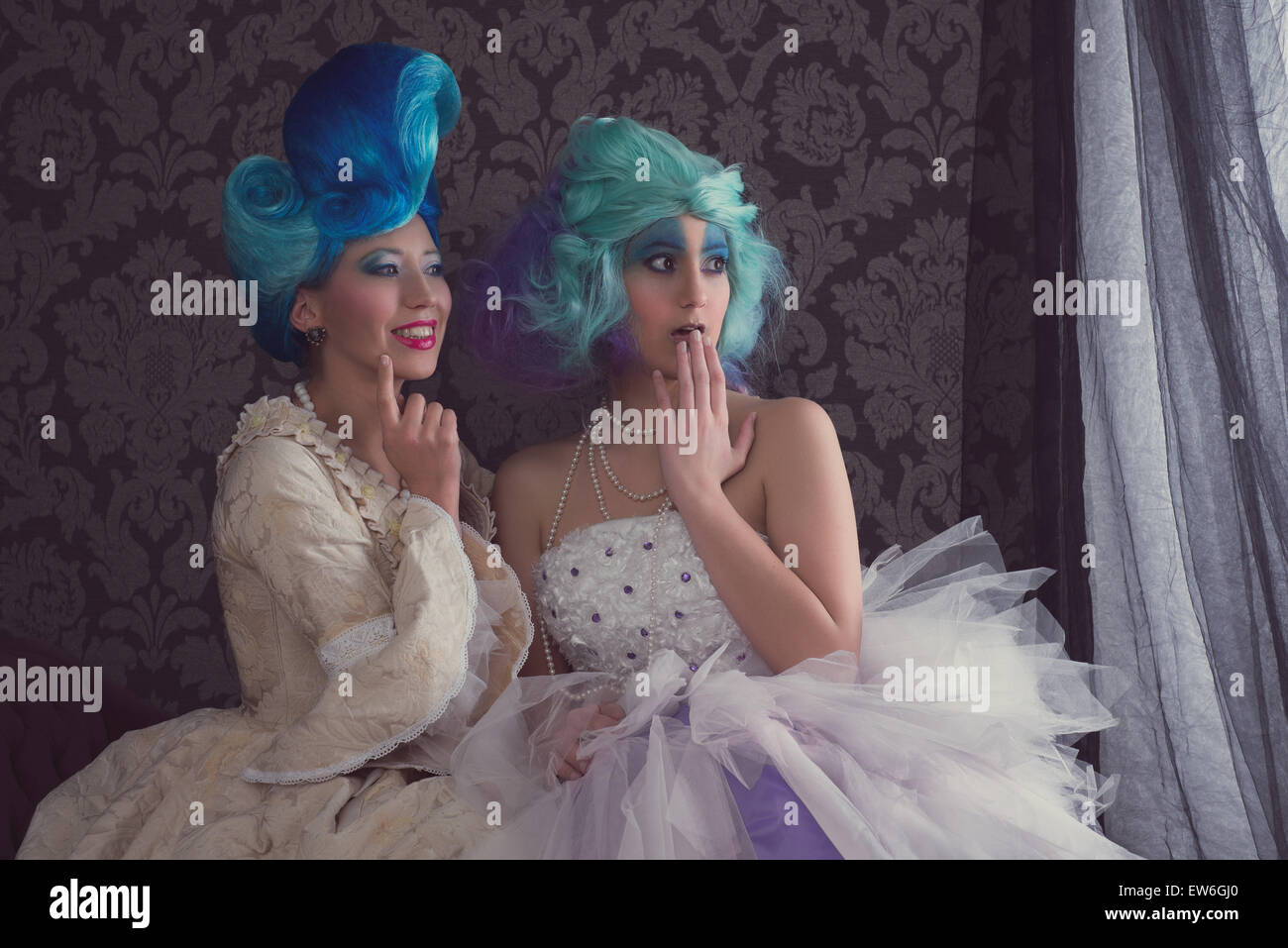 Two women in prom or historical dresses Stock Photo