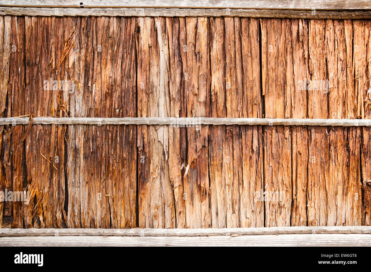 Japan, Onomichi. Traditional rural wooden fence made from tree bark with two horizontal support boards. Pattern. Stock Photo