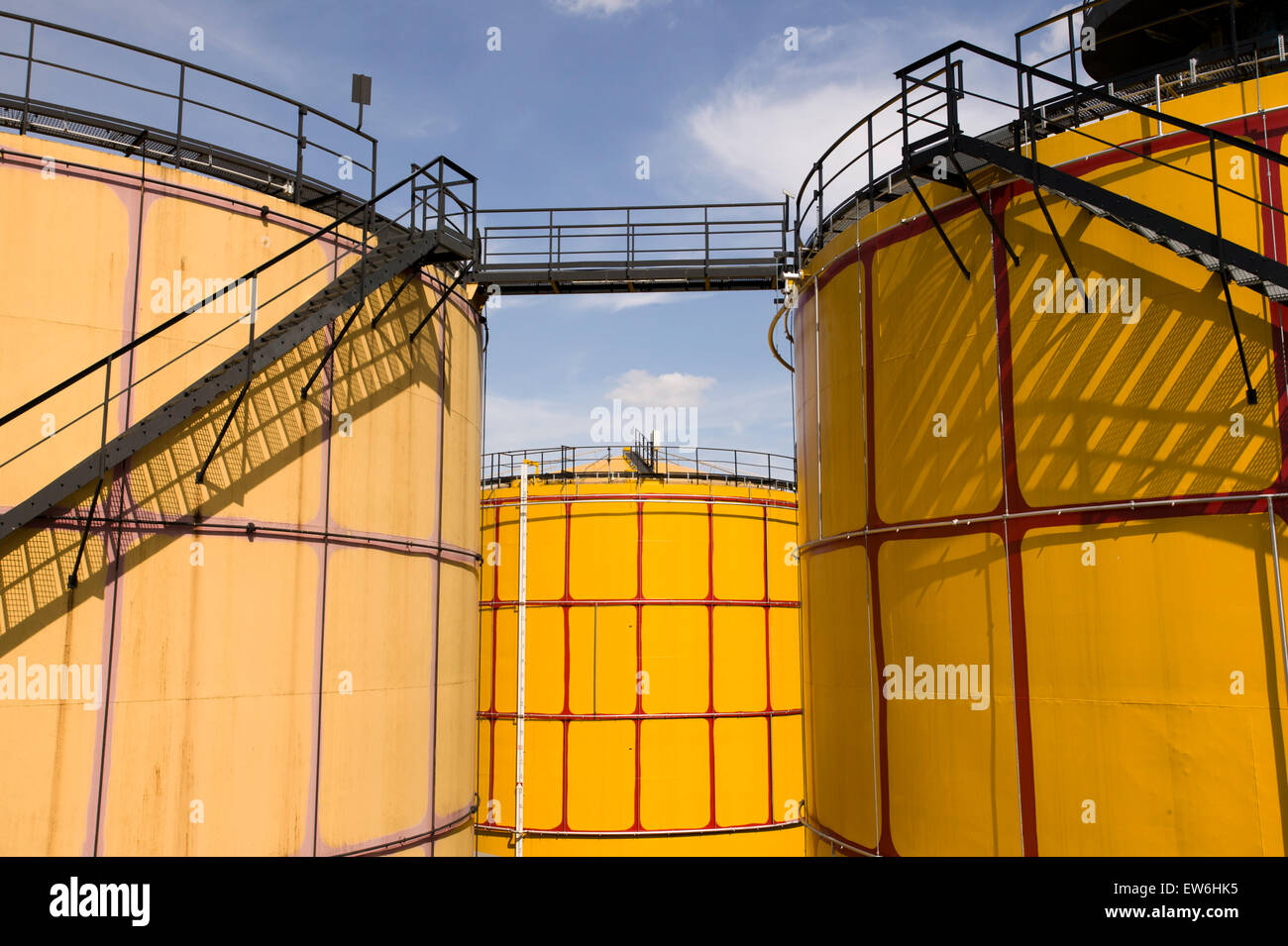 Yellow oil storage tanks painted in the Hundertwasser style in Vienna, Austria. Stock Photo