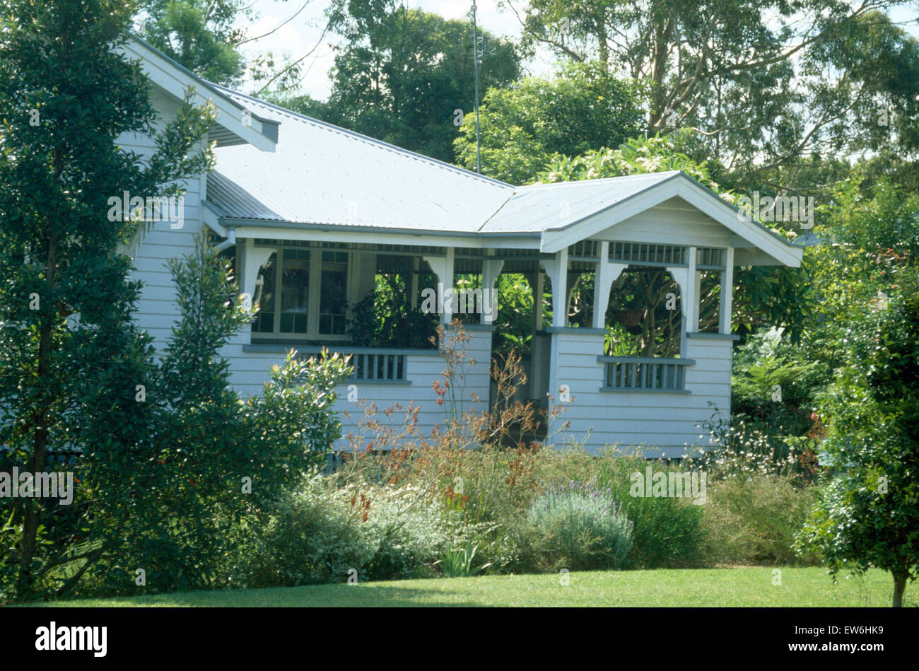 Exterior of a clapboard house in Australia with ornate wrought iron