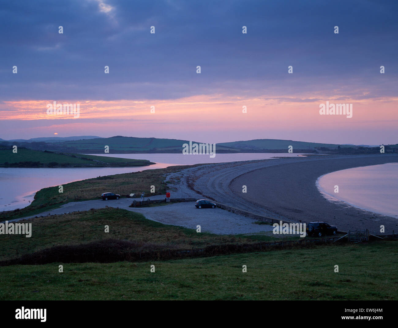 Cemlyn Bay, Anglesey, crescent-shaped shingle bar & brackish lagoon fed by fresh water: a National Nature Reserve owned by the National Trust. Stock Photo