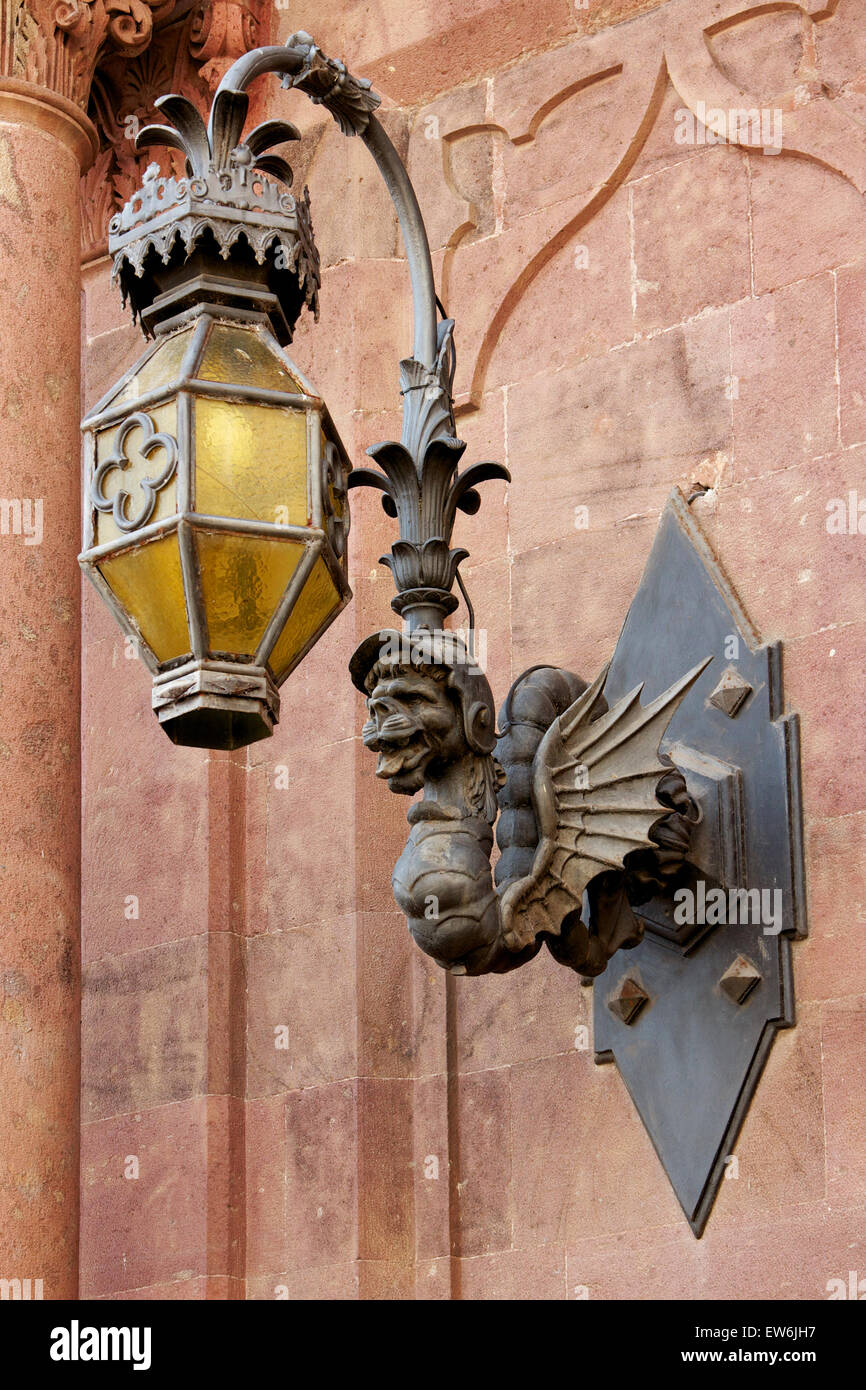 Grotesque street lamp in the form of a winged serpent in Sassari, Sardinia Stock Photo