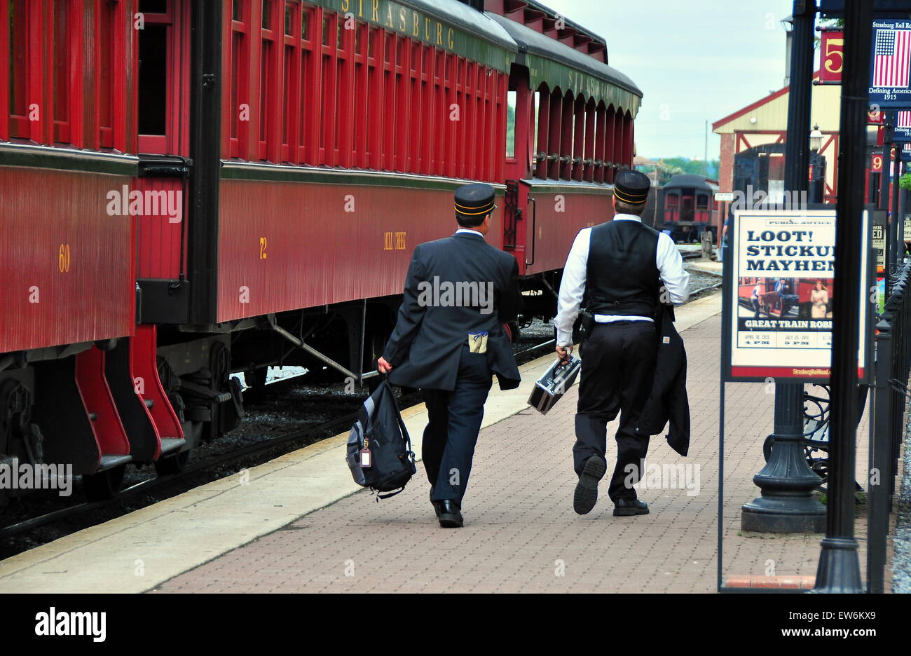 Strasburg, Pennsylvania:  Two conductors walking the platform next to vintage passenger cars at the Strasburg Railroad  * Stock Photo