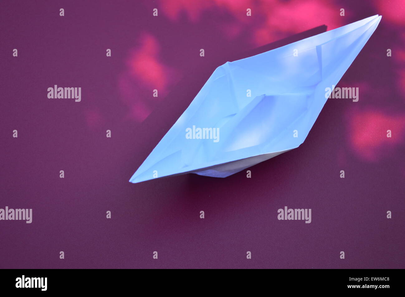 A folded paper boat Stock Photo - Alamy