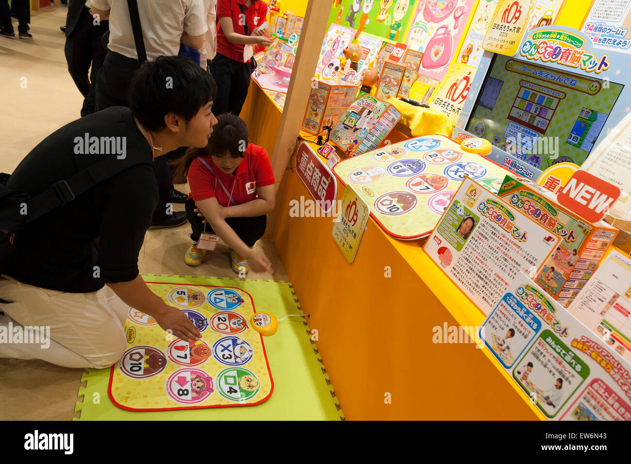 A man tries the products of JoyPalette Co., LTD. during the International Tokyo Toy Show 2015 in Tokyo Big Sight on June 18, 2015, Tokyo, Japan. Japan's largest trade show for toy makers attracts buyers and collectors by introducing the latest products from different toymakers from Japan and overseas. The toy fair showcases about 35,000 toys from 149 domestic and foreign companies and is held over four days. © Rodrigo Reyes Marin/AFLO/Alamy Live News Stock Photo