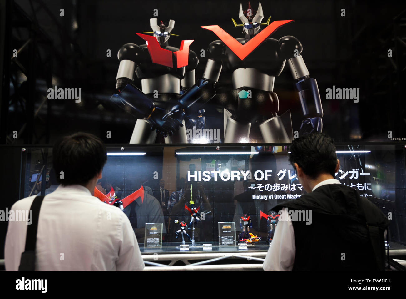 Visitors look at the action figures of Mazinger at the International Tokyo Toy Show 2015 in Tokyo Big Sight on June 18, 2015, Tokyo, Japan. Japan's largest trade show for toy makers attracts buyers and collectors by introducing the latest products from different toymakers from Japan and overseas. The toy fair showcases about 35,000 toys from 149 domestic and foreign companies and is held over four days. © Rodrigo Reyes Marin/AFLO/Alamy Live News Stock Photo