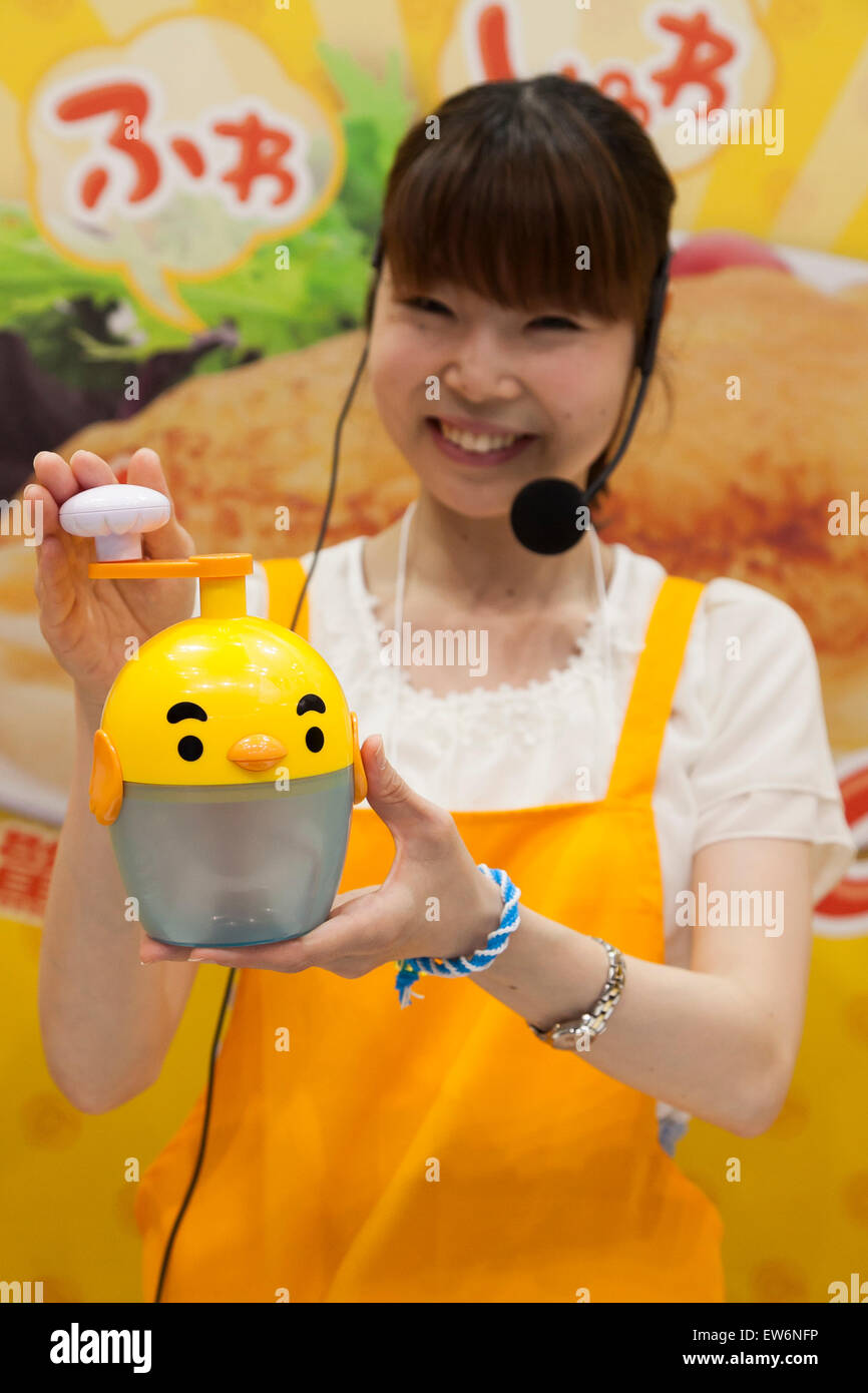 An exhibitor shows a mixer for omurice (omelette and rice) at the International Tokyo Toy Show 2015 in Tokyo Big Sight on June 18, 2015, Tokyo, Japan. Japan's largest trade show for toy makers attracts buyers and collectors by introducing the latest products from different toymakers from Japan and overseas. The toy fair showcases about 35,000 toys from 149 domestic and foreign companies and is held over four days. © Rodrigo Reyes Marin/AFLO/Alamy Live News Stock Photo