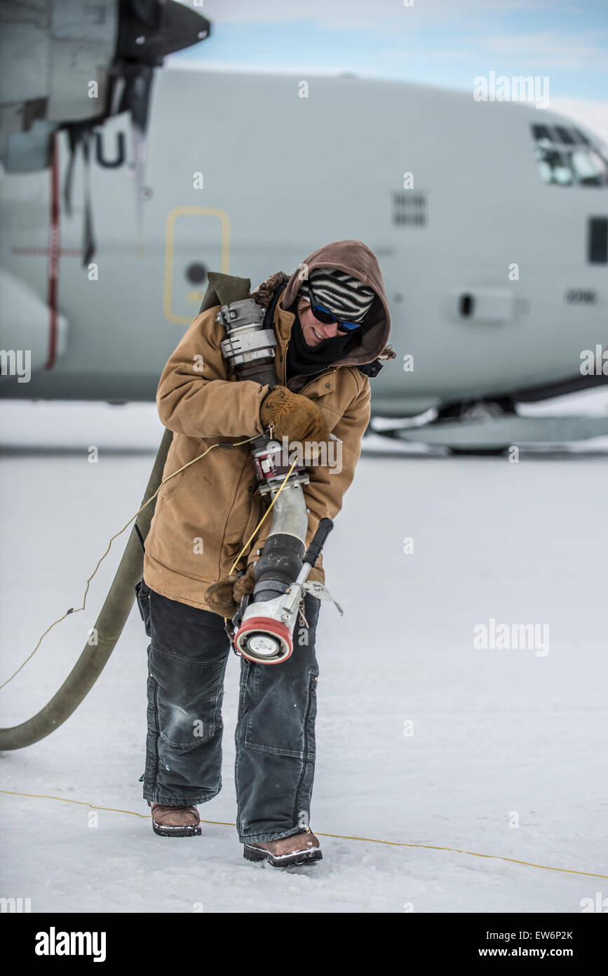Woman Refules an USAF LC-130 at McMurdo Station, Antarctica Stock Photo