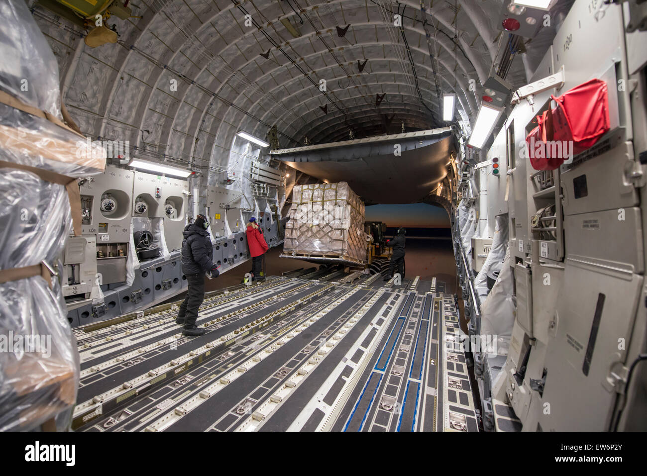 Unloading a USAF C-17 cargo aircraft at McMurdo Station, Antarctica. Stock Photo