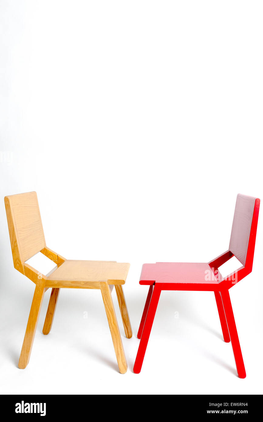 Two modernistic wooden chairs facing each other Stock Photo 84358208