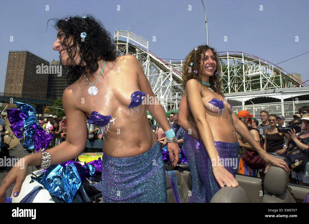 Jen Cohen (L) and  Elizabeth Gabbay (R) frolic in The Mermaid Parade in famed Coney Island on Surf Avenue on June 22, 2002.  The parade,  which celebrates the coming of the Summer Season brings outs eccentrics, exhibitionists and just plain old folk in their finest Mermaid, Merman and sometimes unrecognizable costumes.  (© Frances M. Roberts) Stock Photo