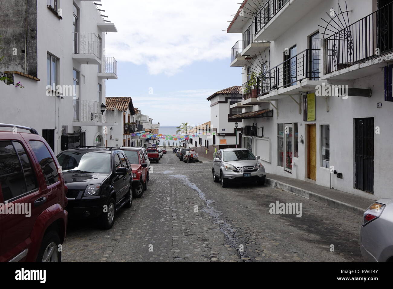 Street in downtown Puerto Vallarta leading to the beach Stock Photo