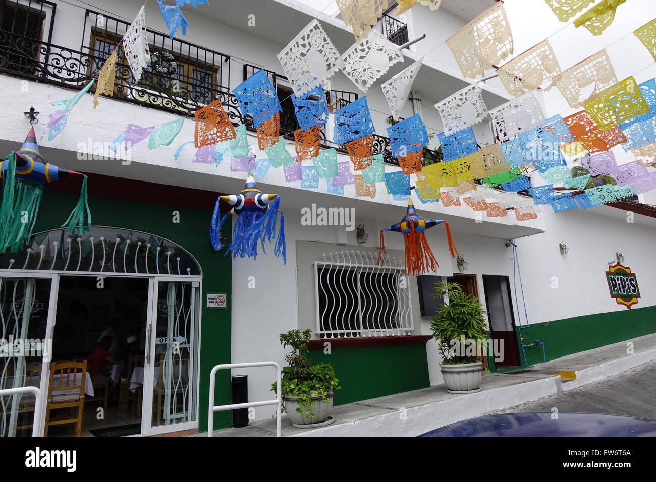 Flags and other decorations, downtown Puerto Vallarta, Mexico Stock Photo