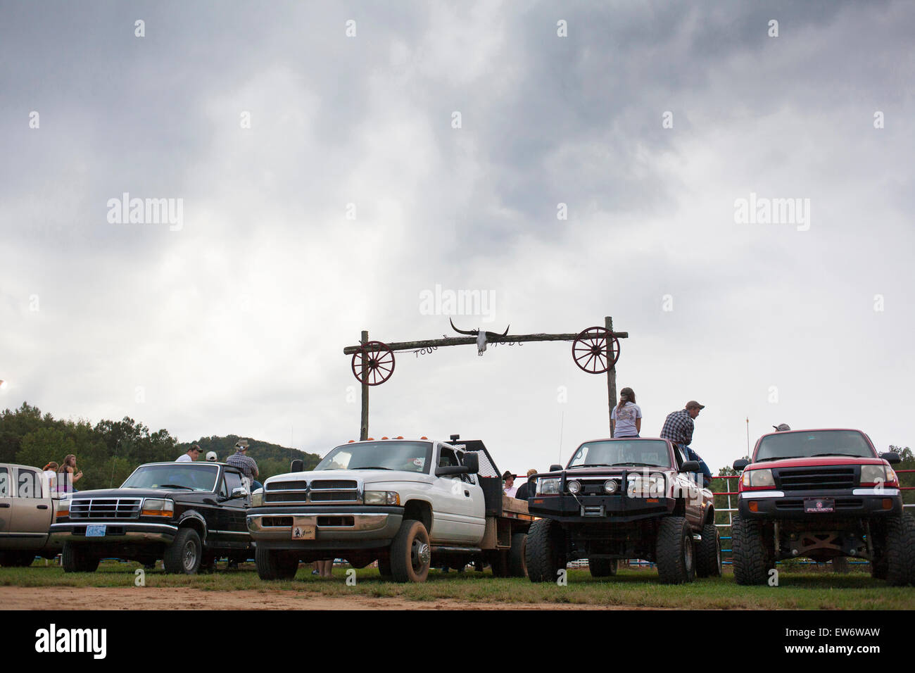 People sit on pickup trucks to watch a rodeo in Granite Falls, NC Stock