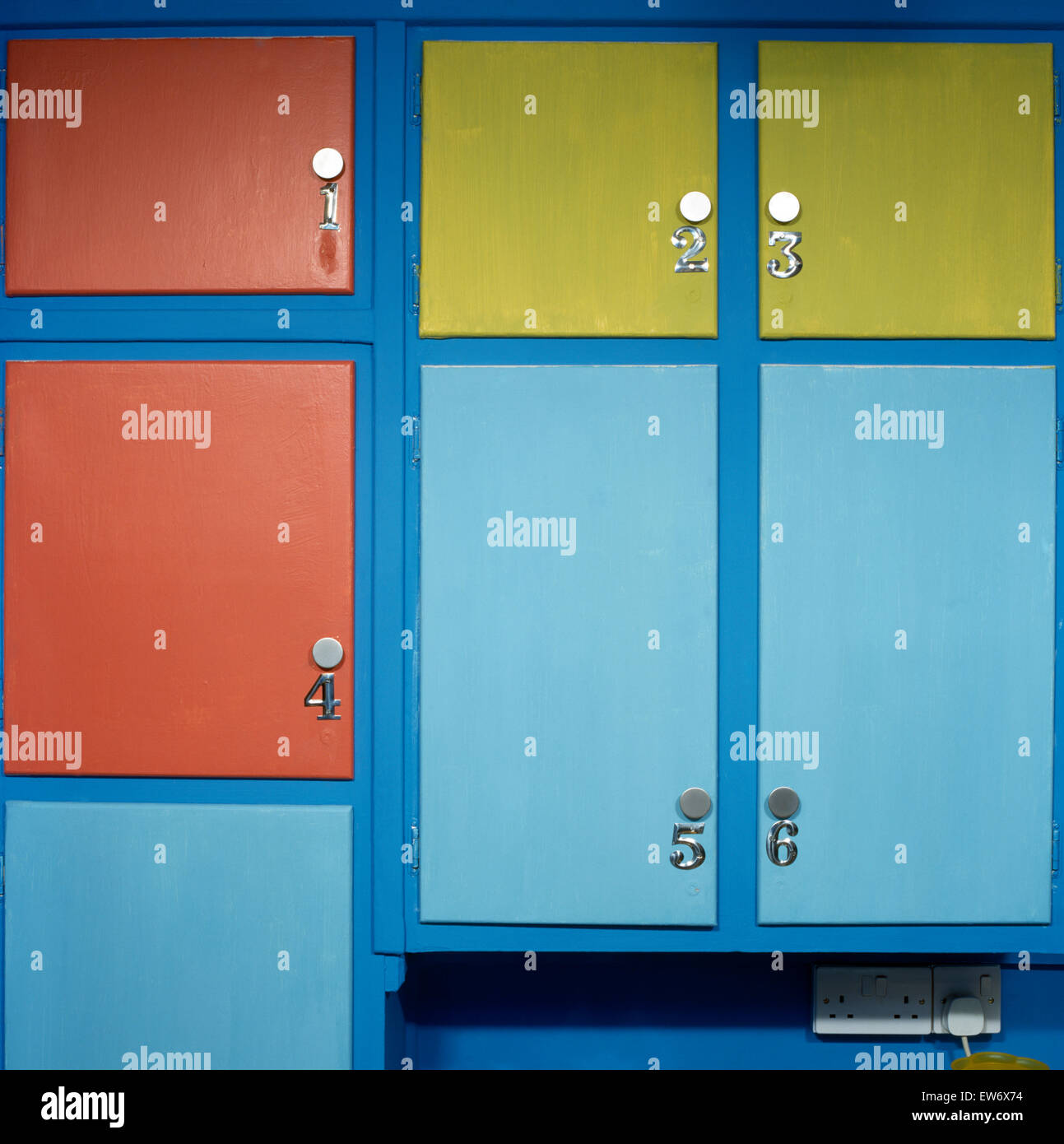 Closeup of numbered, painted kitchen cupboards Stock Photo Alamy
