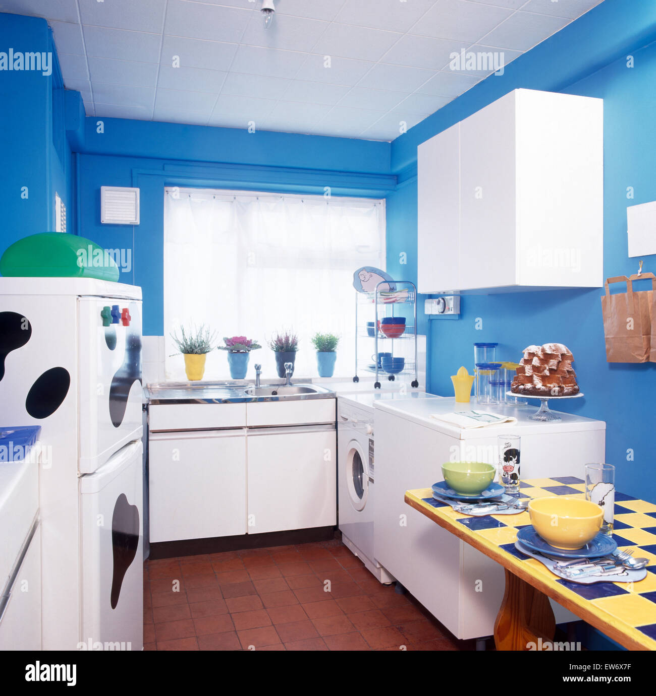 Bright blue, economy style nineties kitchen Stock Photo