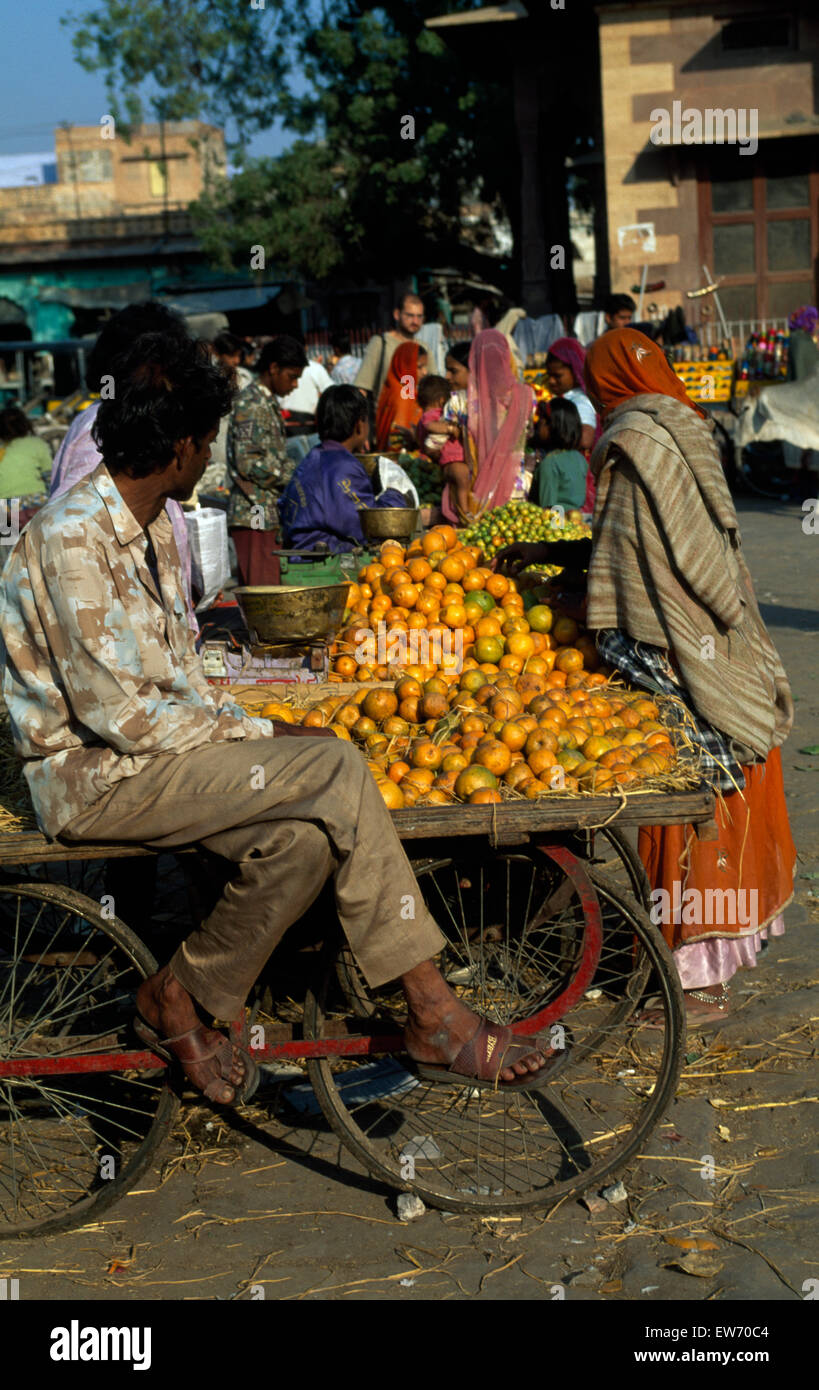 Vendor with a cart of oranges in an Indian street market         FOR EDITORIAL USE ONLY Stock Photo