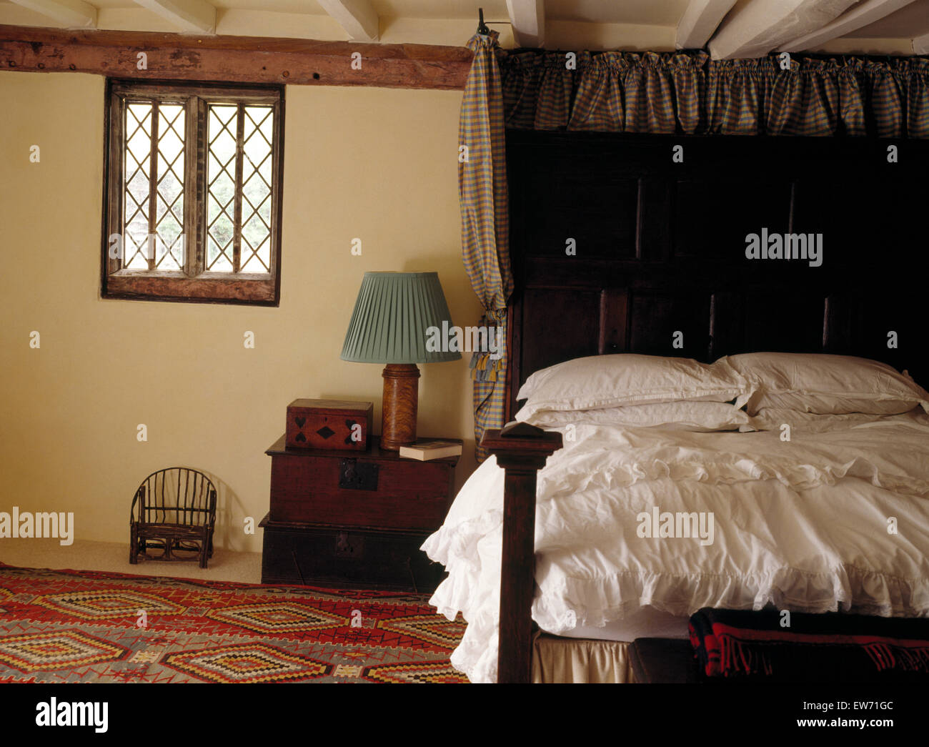 Antique Half Tester Oak Bed In An Old Fashioned Bedroom With