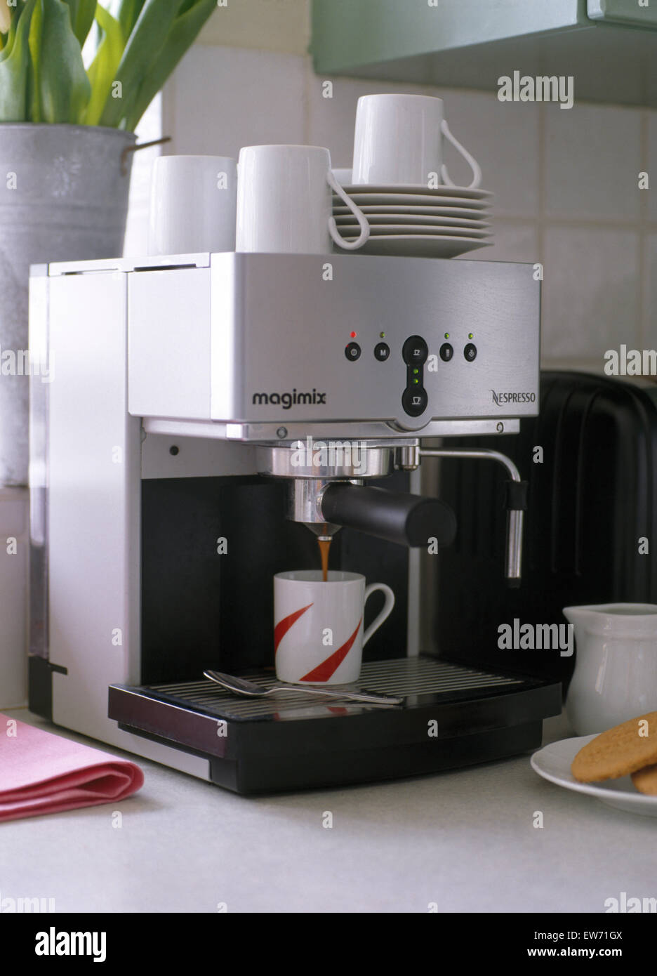 Close-up of coffee machine with white cups Stock Photo - Alamy