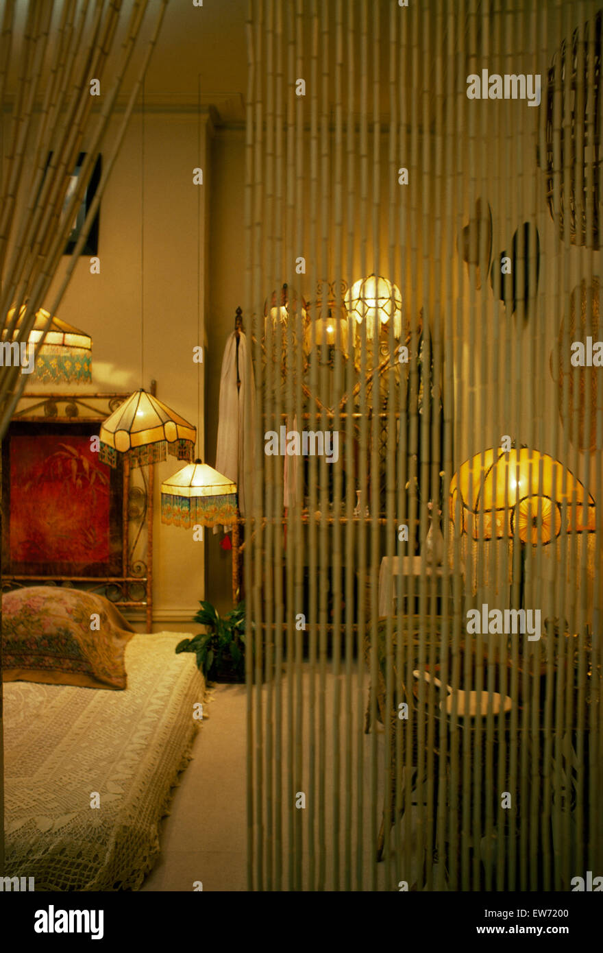 Bamboo curtain screening sixties bedroom with thirties lamps Stock Photo